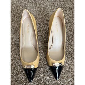 Coach Zan creamy yellow black two tone patent leather pointed toe heels pumps